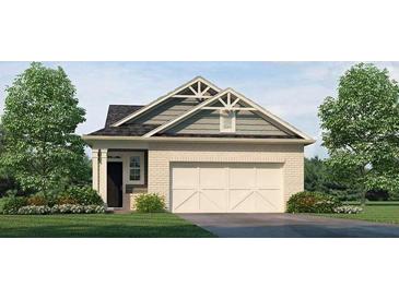 Charming one-story home with a brick facade, complemented by a well-manicured lawn and a two car garage at 2402 Bayberry St, Acworth, GA 30101