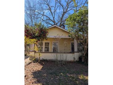 Charming one-story home with a covered porch and mature trees at 319 Kendrick Se Ave, Atlanta, GA 30315