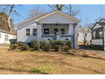 Charming bungalow with a welcoming front porch and well-maintained landscaping at 495 Woodlawn Ave, Atlanta, GA 30318