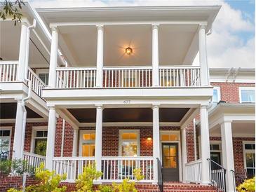 Beautiful exterior view of a brick home with a covered front porch and white columns at 677 Brennan Dr, Decatur, GA 30033