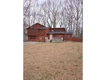 Charming two-story home with a wooden deck and front yard at 805 Wayside Dr, Lawrenceville, GA 30046