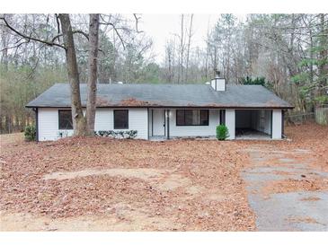 Charming single story home featuring a covered carport and mature trees in a quiet neighborhood at 3436 Lake Monroe Rd, Douglasville, GA 30135