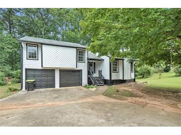 Charming two-story home featuring a two-car garage and well-maintained landscaping at 2940 Leah Ln, Douglasville, GA 30135