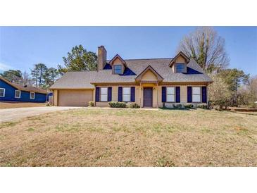 Charming single Gathering home with a well-maintained lawn and inviting curb appeal at 105 Bentley Place Way, Covington, GA 30016