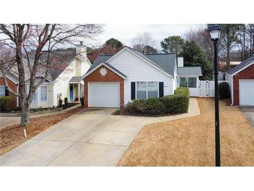 Charming one-story home with a brick-accented garage and neatly maintained landscaping at 2800 Barnwood Xing, Duluth, GA 30097
