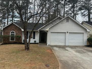 Charming single Gathering home with a two car garage and neutral color scheme at 4227 Sheppard Xing Way, Stone Mountain, GA 30083