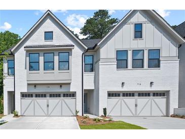 Beautiful new construction townhomes featuring modern farmhouse style and two-car garages at 130 Briargate Dr, Johns Creek, GA 30097
