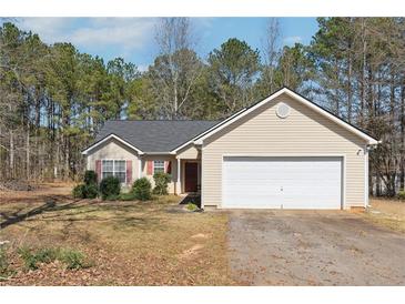 Charming single-story home with a two-car garage and well-maintained front lawn at 403 Keys Ferry Rd, Mcdonough, GA 30252