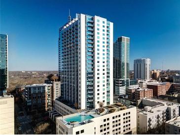 Modern high-rise with balconies, cityscape views, and a rooftop pool at 860 Peachtree Ne St # 917, Atlanta, GA 30308