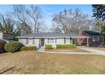 Charming ranch-style home featuring a well-manicured lawn and inviting front entrance at 2716 Wedgewood Ter, Decatur, GA 30032