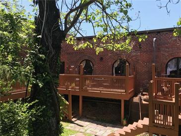 Unique brick exterior with a wooden deck and arched windows at 184 Sw Walker Street # E, Atlanta, GA 30313