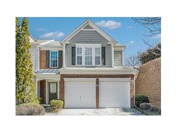 Charming two-story home with brick and gray siding and a two-car garage in a well-maintained community at 3600 Elkhorn Nw Ct, Duluth, GA 30096
