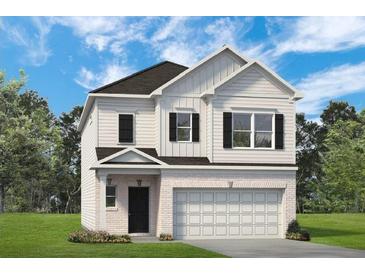 Charming two-story home with white siding, brick accents and an attached two-car garage at 1385 Elowen Dr, Austell, GA 30168
