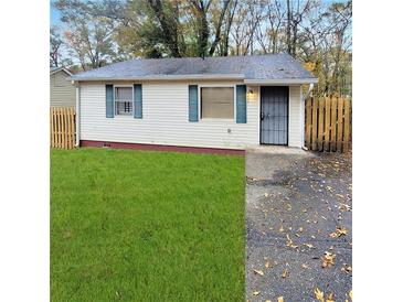 Charming single-story home with a well-manicured lawn and freshly painted exterior at 2061 Detroit Nw Ave, Atlanta, GA 30314