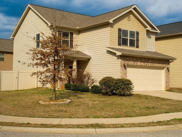 Charming two-story home featuring a two-car garage and well-maintained front yard at 11978 Quail Rd, Hampton, GA 30228