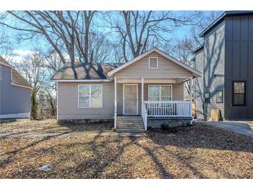 Charming one-story home with a cozy front porch and inviting curb appeal at 1324 North Avenue, Atlanta, GA 30318