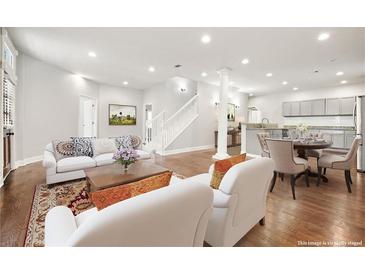 Bright living room featuring hardwood floors, modern furnishings, and an open-concept design at 789 Cooper Sw St, Atlanta, GA 30315