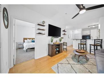 Bright living room featuring an open floor plan, hardwood floors, and stylish decor at 821 Ralph Mcgill Ne Blvd # 3201, Atlanta, GA 30306