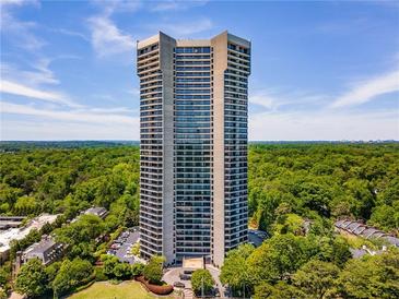 Stunning high-rise with breathtaking views surrounded by lush greenery on a beautiful sunny day at 2660 Peachtree Nw Rd # 14D, Atlanta, GA 30305