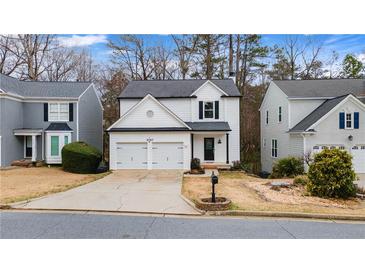 Charming two-story home with a two-car garage and well-maintained landscaping at 1050 Westwell Run, Alpharetta, GA 30022