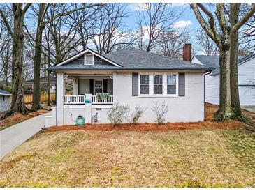Charming one-story home with a covered front porch and a well-maintained yard at 942 Byron Sw Dr, Atlanta, GA 30310