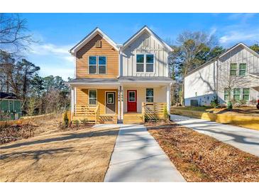 Charming two-story duplex with inviting front porches and colorful front doors at 1106B Wedgewood Nw Dr, Atlanta, GA 30318