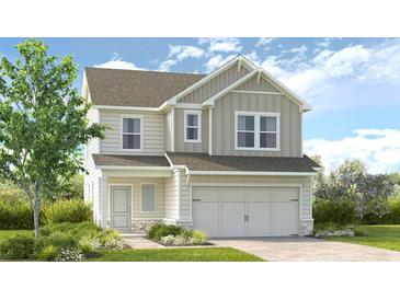 Charming two-story home with vertical siding, a two-car garage, and a well-manicured lawn at 211 Groveton Ct, Euharlee, GA 30145