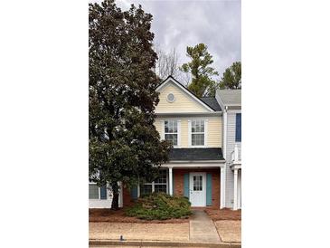 Charming two-story home with a welcoming front porch and well-maintained landscaping at 51 Highoak Ne Dr # 12, Marietta, GA 30066