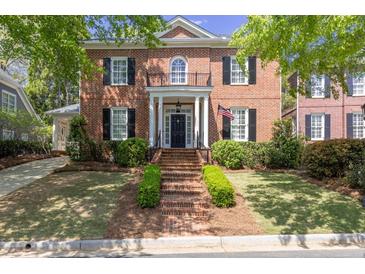 Charming brick home featuring a manicured front yard, brick steps, and black shutters at 3448 Paces Ferry Cir, Smyrna, GA 30080