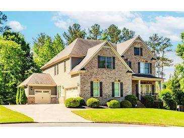 Charming brick home with manicured lawn and three car garage at 3621 Sutters Pond Way, Kennesaw, GA 30152