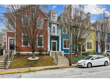 Charming multi-colored townhomes with neat landscaping and a street view at 611 Irwin Ne St, Atlanta, GA 30312