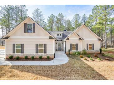 Charming one-story home boasts a stone accent, symmetrical design, and a welcoming entrance at 1312 Mcgarity Rd, Temple, GA 30179