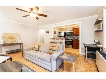 Cozy living room features stylish decor and ceiling fan at 300 W Peachtree St # 4A, Atlanta, GA 30308