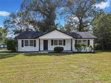 Charming home featuring a manicured front yard and a classic, welcoming facade at 463 Flint Trl, Jonesboro, GA 30236