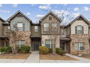 Charming townhome featuring brick and siding, complemented by well-maintained landscaping at 2783 Bayrose Cir # 83, Atlanta, GA 30344