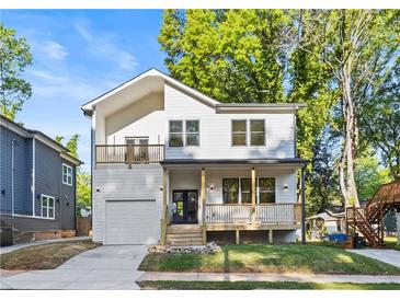 Charming two-story new construction home with a welcoming front porch and a one car garage at 61 Newcastle Sw St, Atlanta, GA 30314