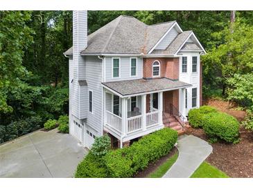 Charming two-story home with a welcoming front porch and well-maintained landscaping at 2690 Valvedere Dr, Brookhaven, GA 30319