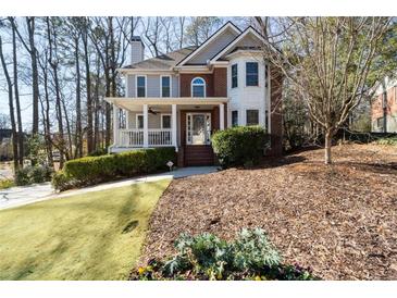 Charming two-story home with a welcoming front porch and well-maintained landscaping at 2690 Valvedere Dr, Brookhaven, GA 30319