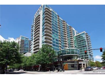 A wide angle shot of a high rise building with balconies and glass windows on a sunny day at 923 Peachtree Ne St # 1527, Atlanta, GA 30309
