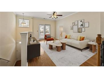 Bright living room with a ceiling fan, plush seating, decor and a balcony view at 1536 Liberty Nw Pkwy, Atlanta, GA 30318