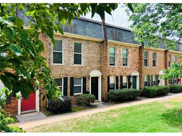 Charming brick townhomes with well-maintained landscaping and neutral colors at 235 Winding River Dr # B, Atlanta, GA 30350