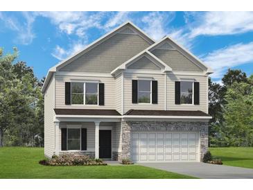 Charming two-story home with stone accents, black shutters, and well-manicured lawn at 523 Lanier Way, Temple, GA 30179