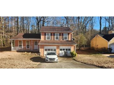 Charming two-story home with attached two-car garage and well-maintained front yard at 991 Park Creek Cir, Lawrenceville, GA 30044