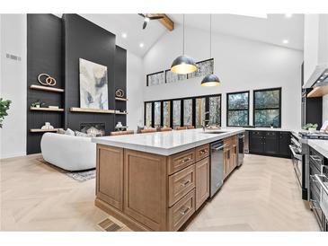 Bright kitchen with a large island, stainless steel appliances, and lots of natural light at 904 Kings Ne Ct, Atlanta, GA 30306