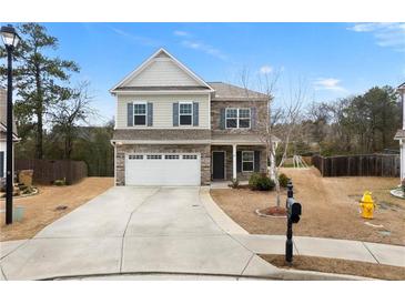 Charming two-story home featuring a two-car garage and a mix of stone and siding at 72 Summer Nw Pl, Cartersville, GA 30121