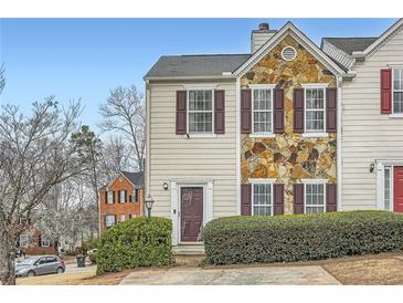 Charming townhome featuring stone accents and mature landscaping at 2510 Thorngate Dr, Acworth, GA 30101