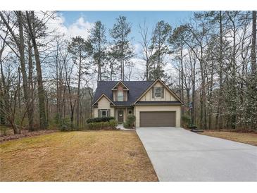 Charming single-Gathering home featuring a well-manicured lawn and a classic suburban design at 2845 Hickory Cir, Snellville, GA 30078
