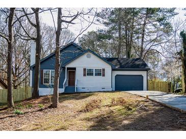 Charming exterior of a two-story home featuring complementary colors and a quaint front yard at 40 Cumberland Dr, Rex, GA 30273