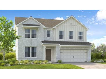 Charming two-story home with white brick, landscaped yard, and attached two-car garage at 205 Groveton Ct, Euharlee, GA 30145