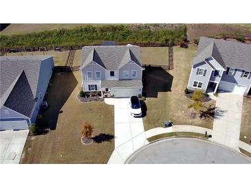 Aerial view of the home, highlighting its spacious yard, modern architecture, and inviting curb appeal at 60 Cottontail Lane, Villa Rica, GA 30180